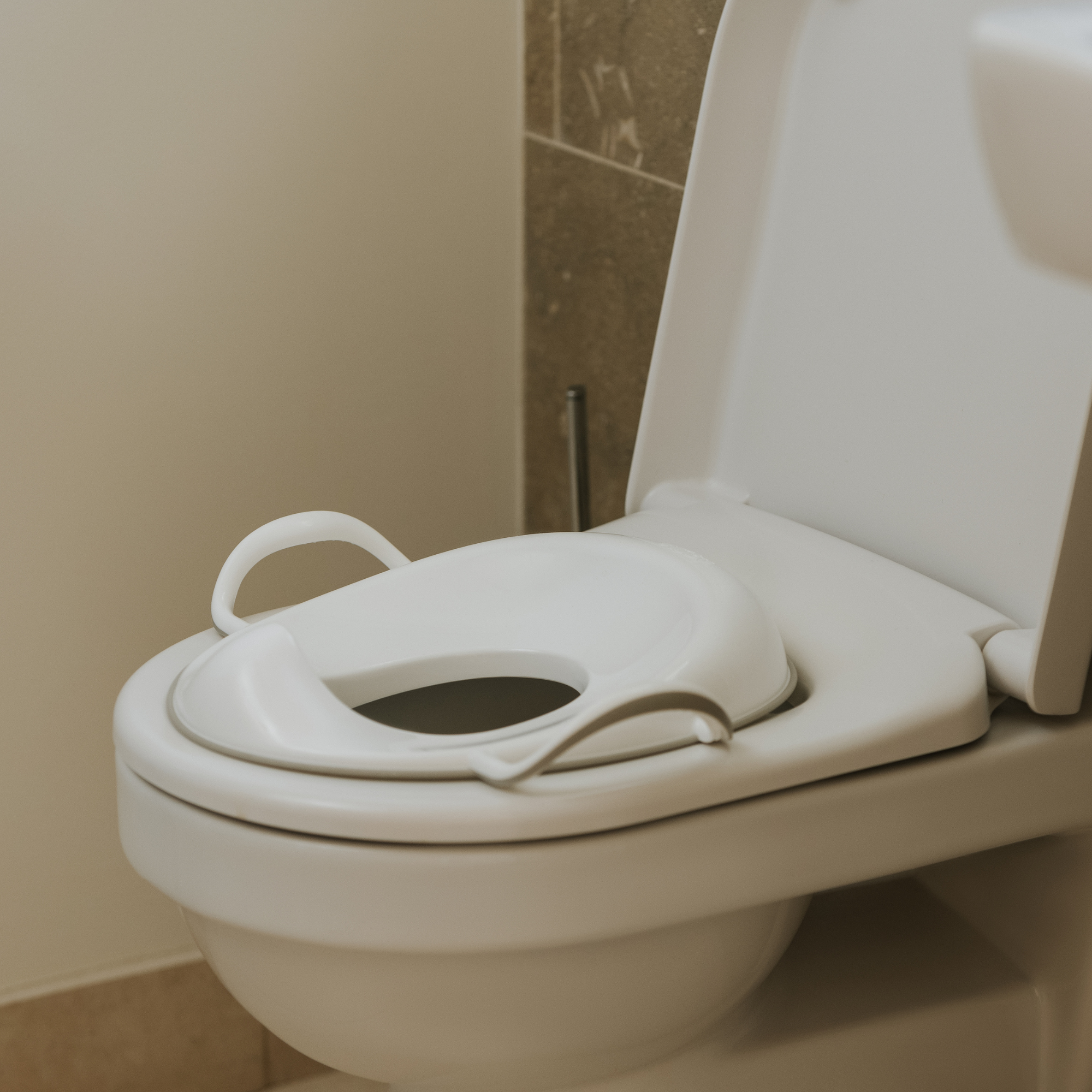 Nuby Sedile di sicurezza per WC con protezione antispruzzo integrata