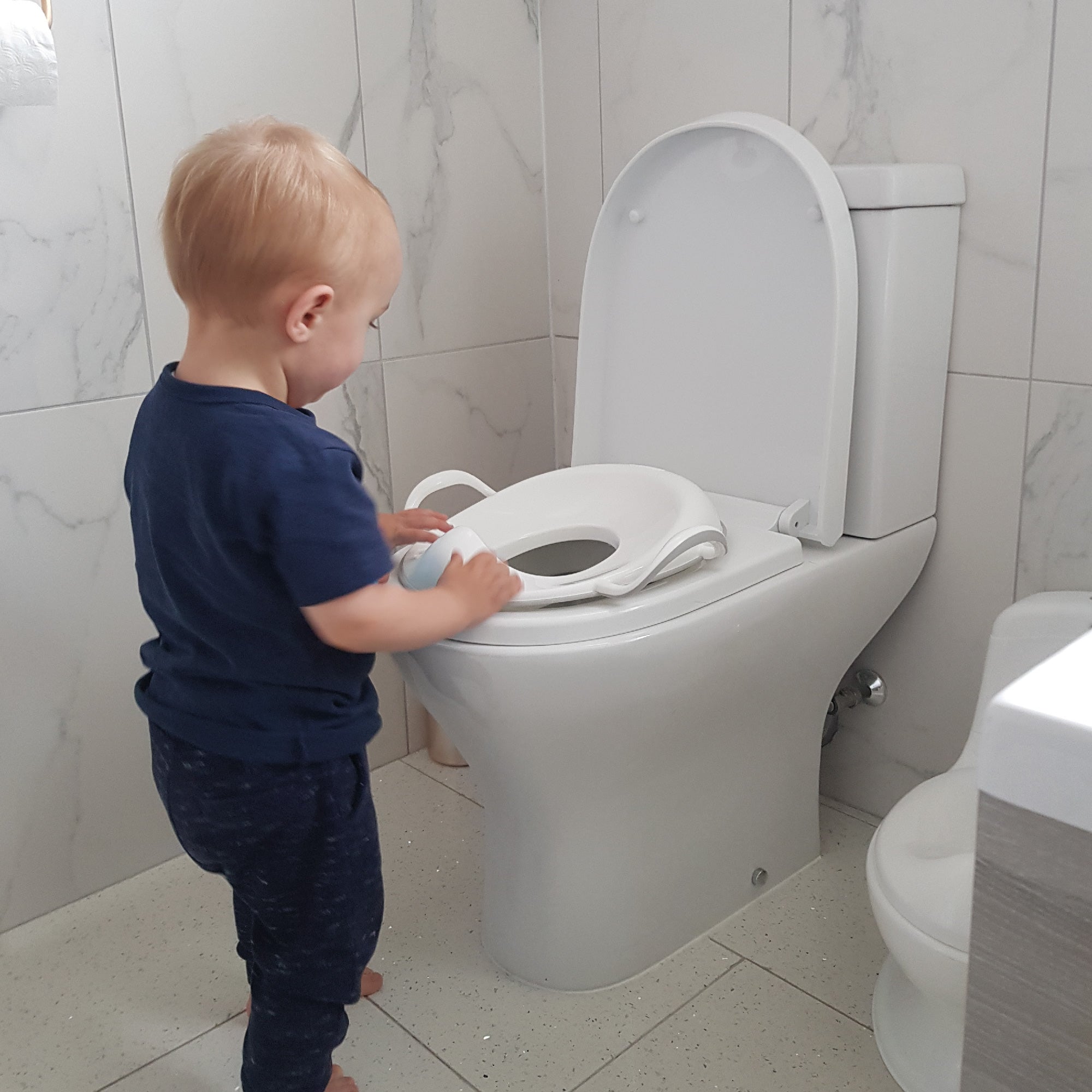 Nuby Siège de toilette de sécurité avec protection anti-éclaboussures intégrée